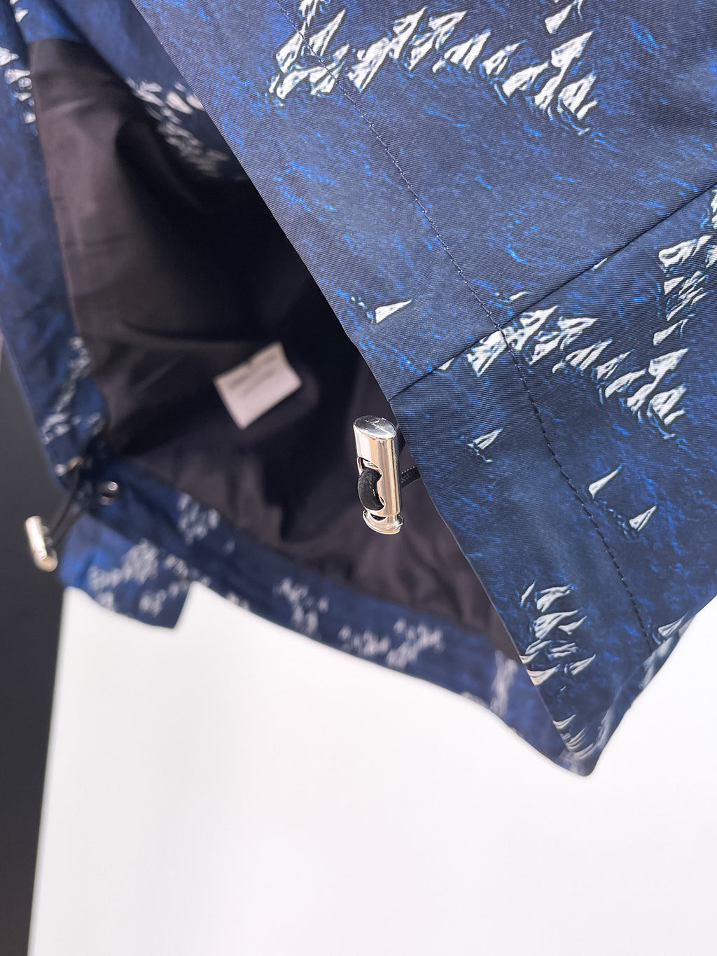 Long Louis Vuitton jacket in blue with white print, front zipper and snap placket