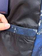 Black inner lining at jacket hem with blue outer fabric