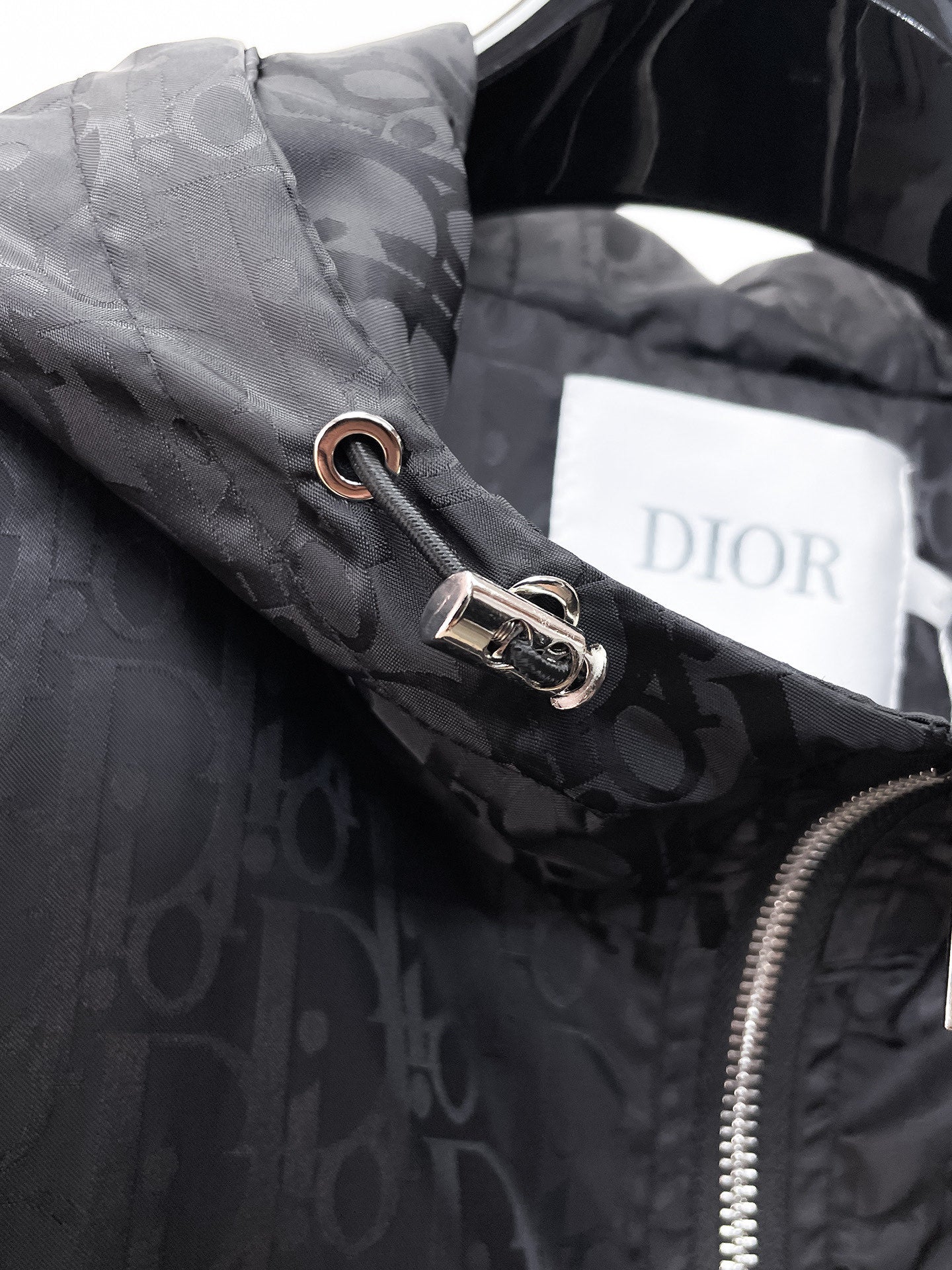 Dior hooded jacket, metal drawcord and zipper pull on patterned front