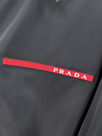 Prada red logo stripe on black long windbreaker jacket chest