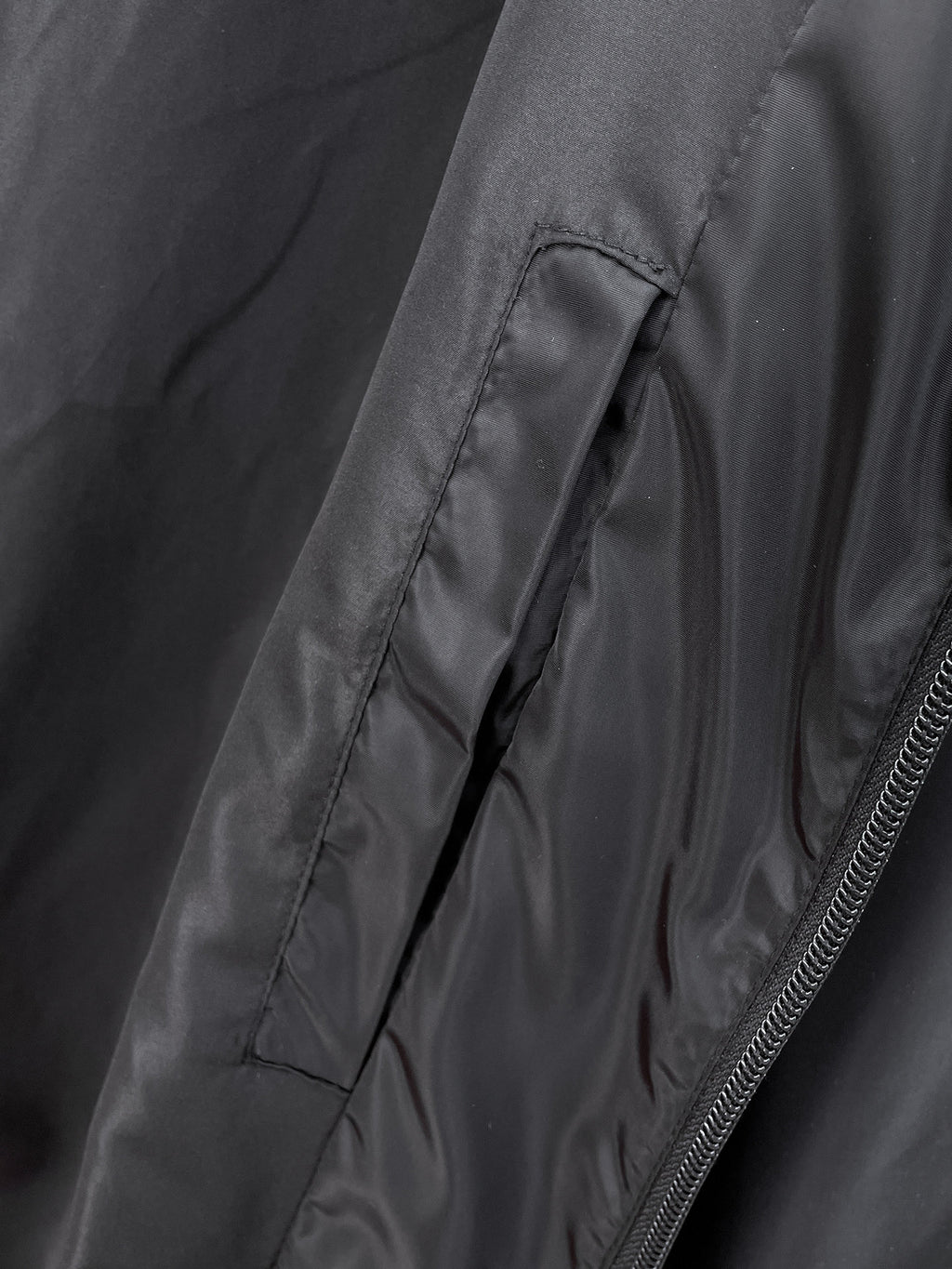 Long coat with zipper and stitched side panel seam