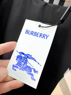 Long coat hanging tag with BURBERRY logo and knight
