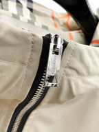 Long coat with beige front and black zipper closure