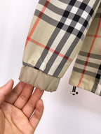 Long coat sleeve cuff with beige and plaid pattern