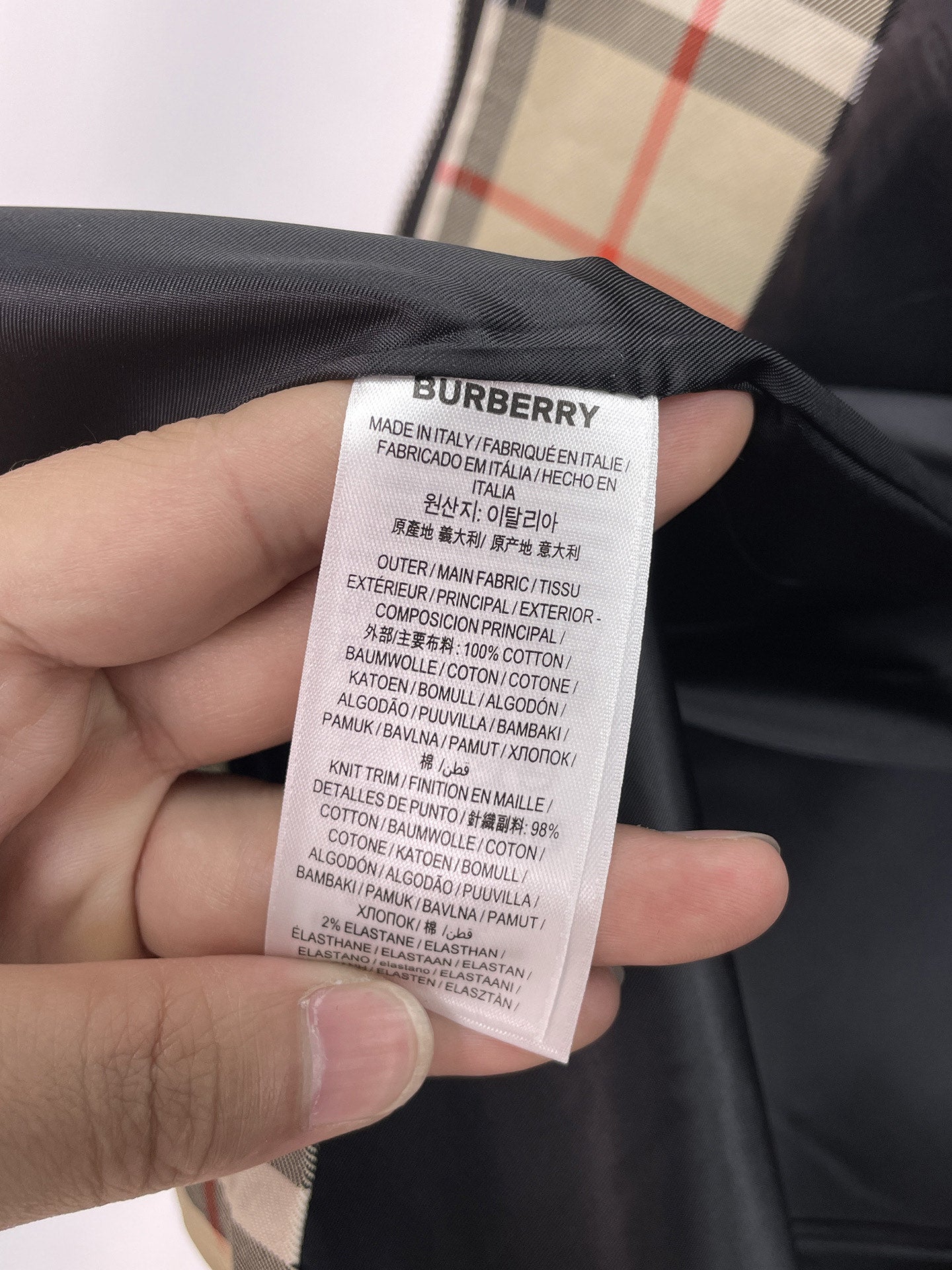 Long coat care label with fabric composition text
