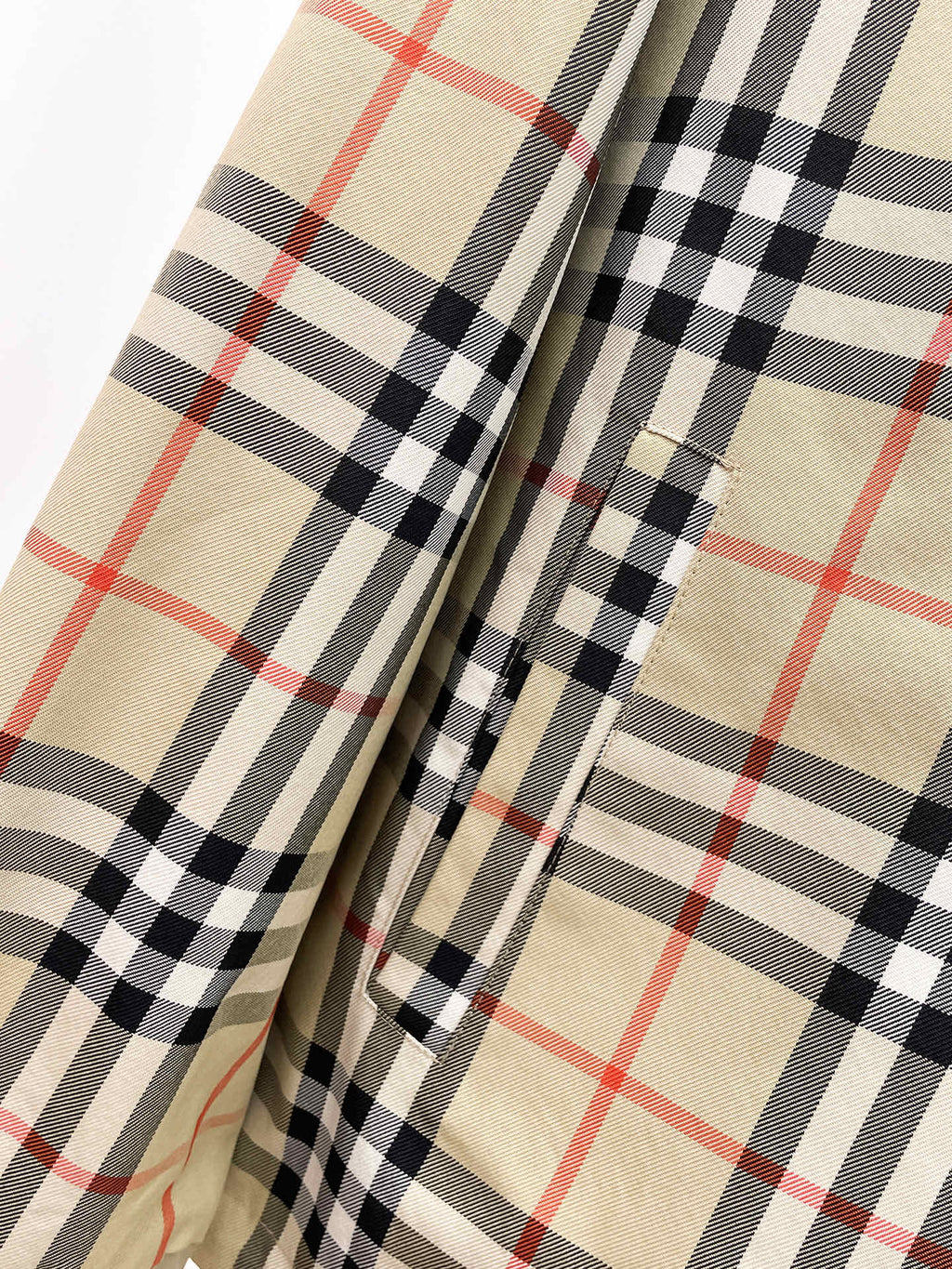 Long coat with beige and black plaid lining panels