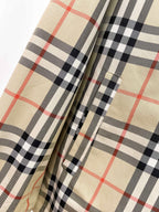 Long coat with beige and black plaid lining panels