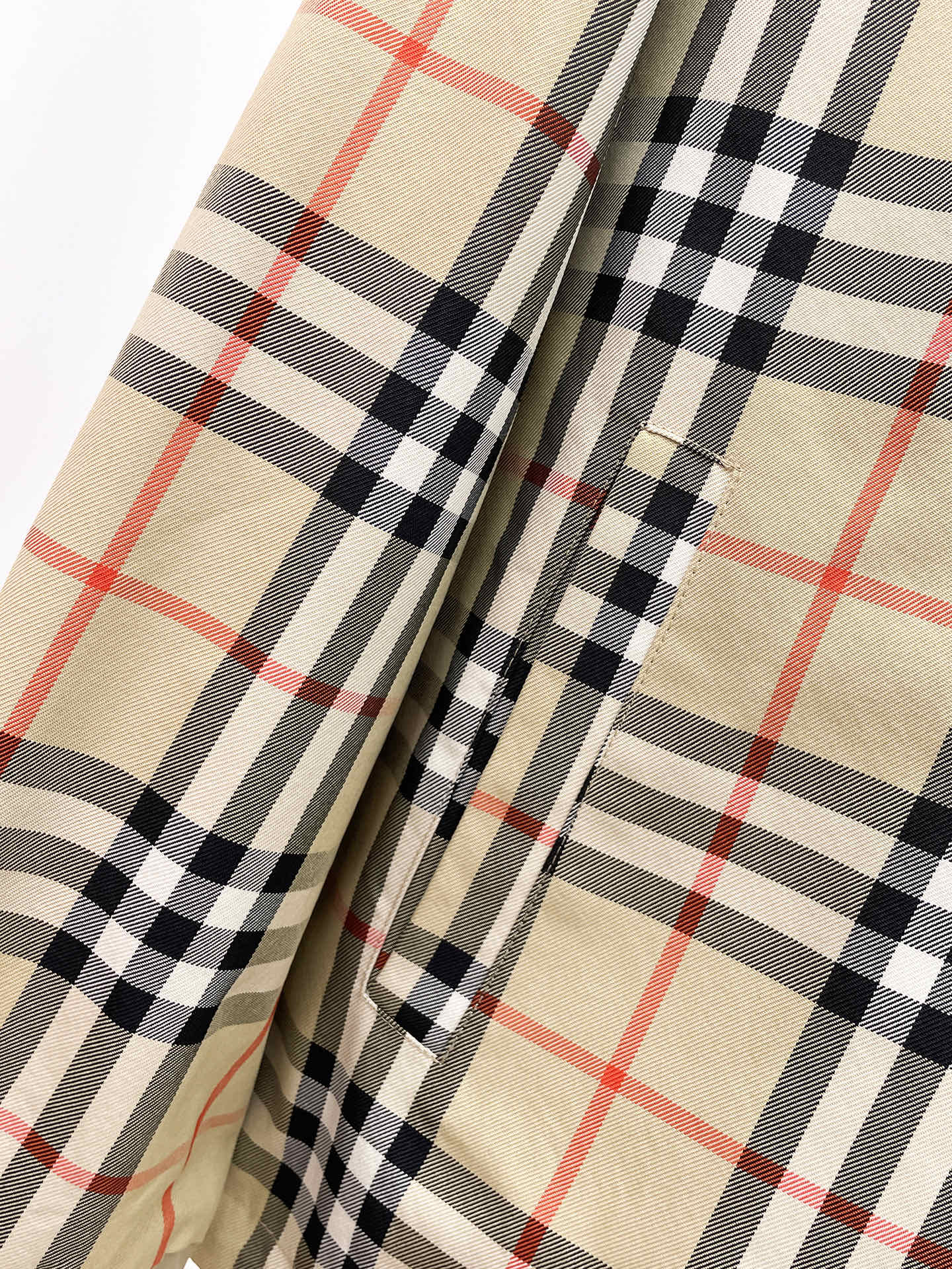 Long coat with beige and black plaid lining panels