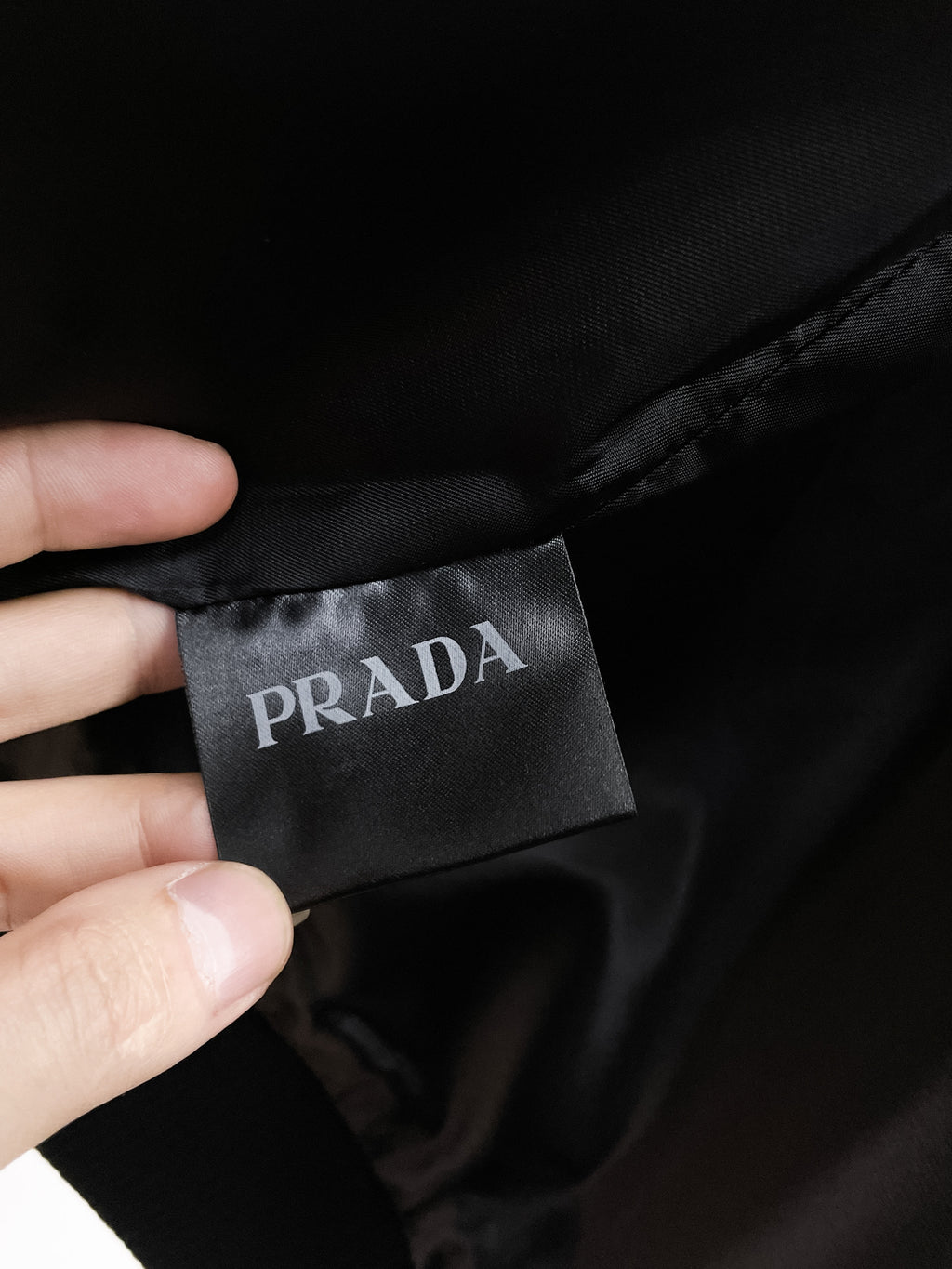 Prada fabric label on black leather jacket lining