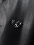 Black leather jacket with Prada triangle metal logo badge