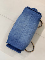 Chanel blue denim clutch with quilted panels, chain strap and gold clasp