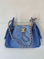 Chanel blue denim handbag with double chain straps and gold logo ornament