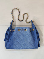 Chanel blue denim handbag with quilted fabric, chain strap and gold logo hardware
