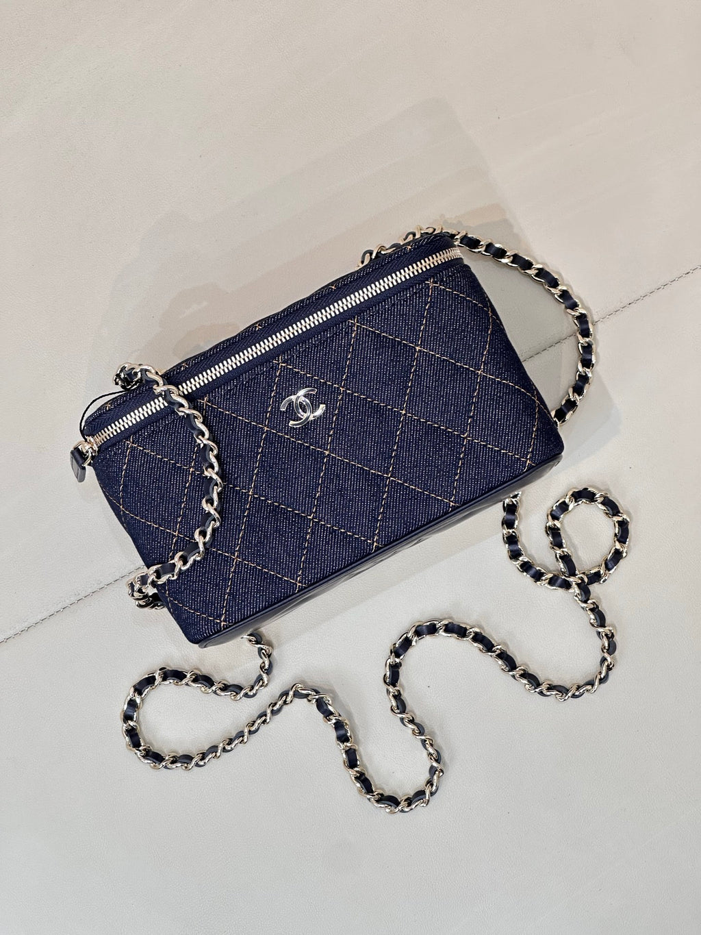 Chanel mini quilted crossbody bag in dark blue with chain strap and top zipper