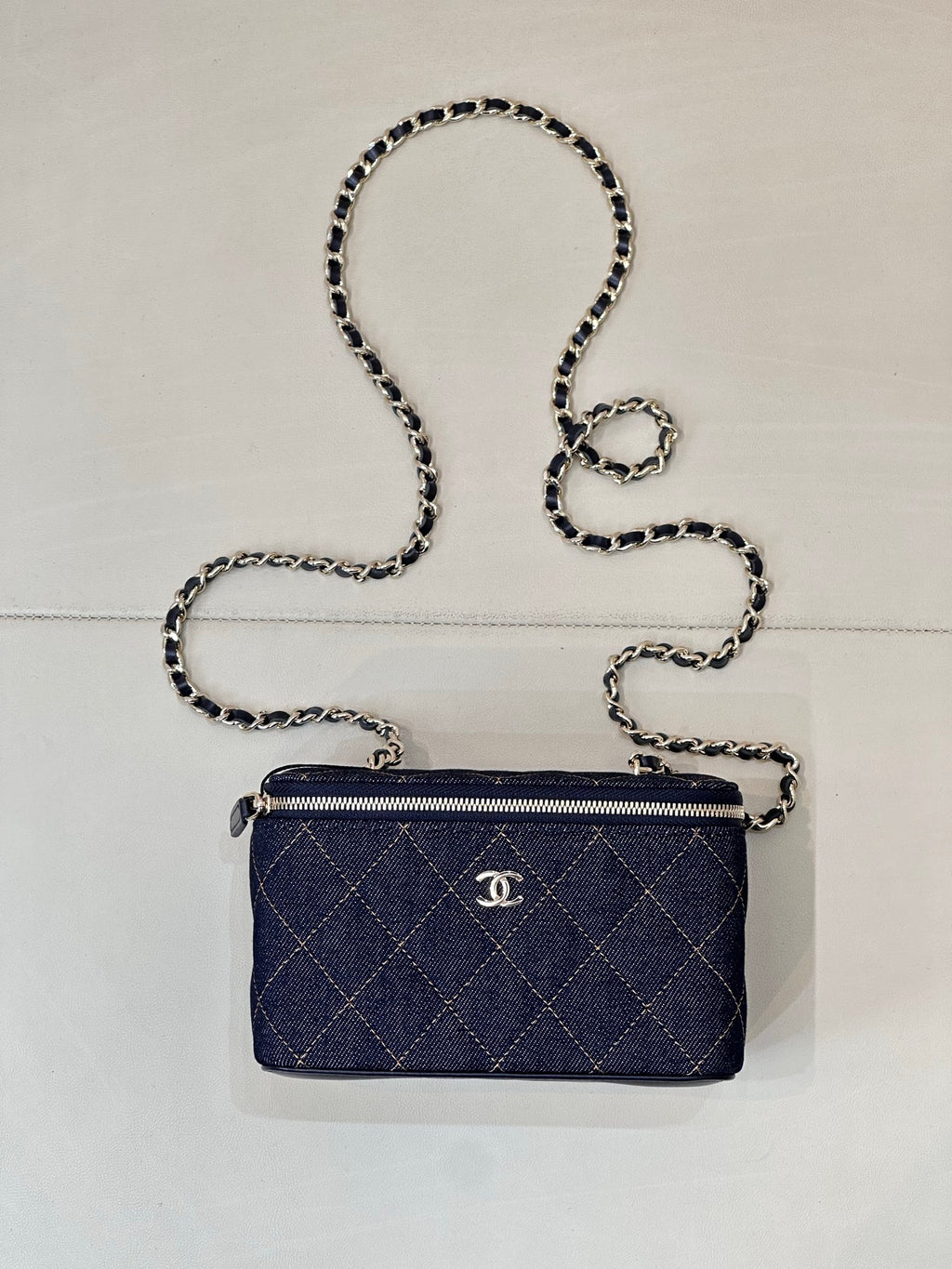 Chanel mini quilted shoulder bag in dark blue with chain strap and top zip