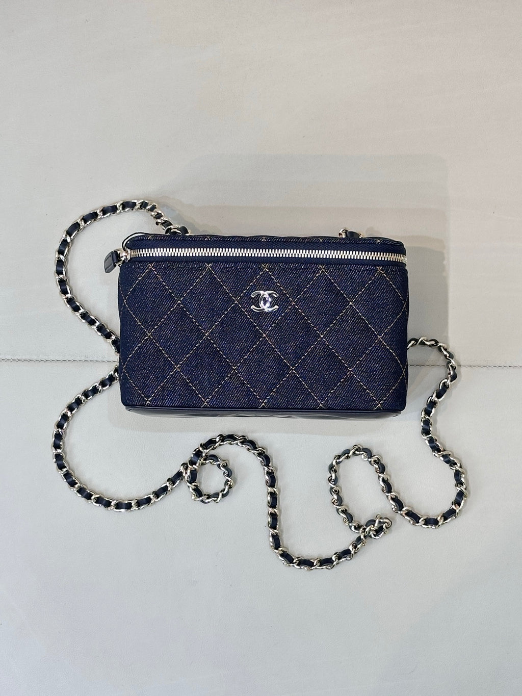 Chanel mini quilted shoulder bag in dark blue with chain strap and zipper closure