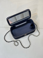 Chanel mini bag interior in dark blue with open top and chain strap