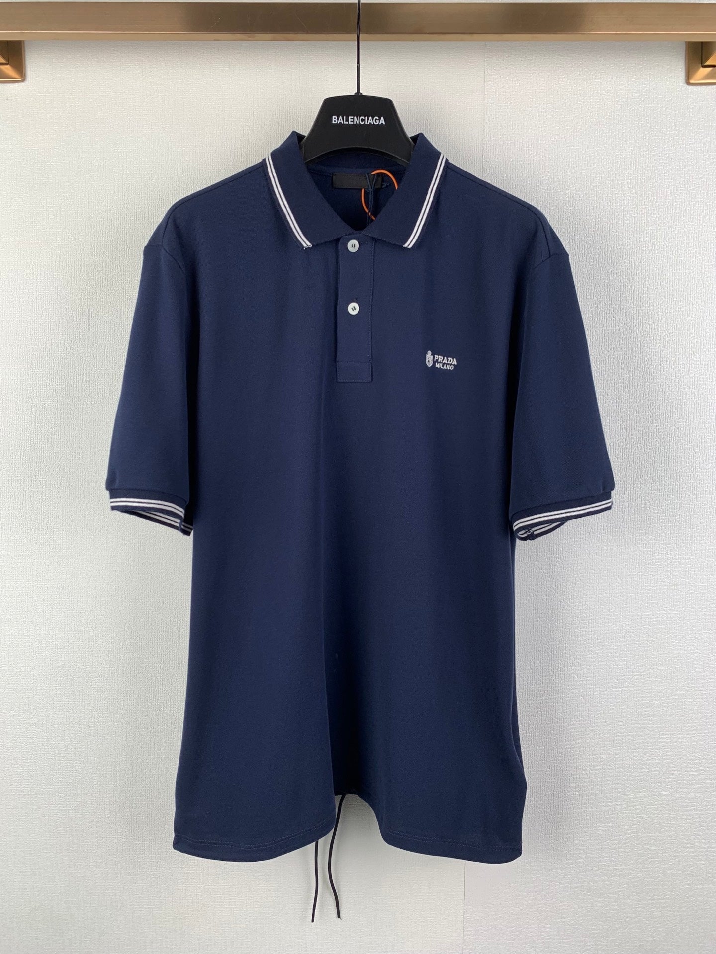 Navy Prada polo shirt with white-striped collar and short sleeves