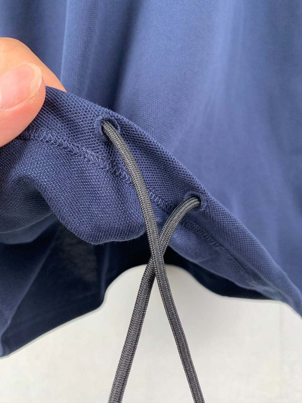 Blue drawstring shorts with eyelet cords