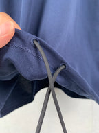 Blue drawstring shorts with eyelet cords
