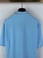 Light blue polo shirt back with white-trim collar and short sleeves