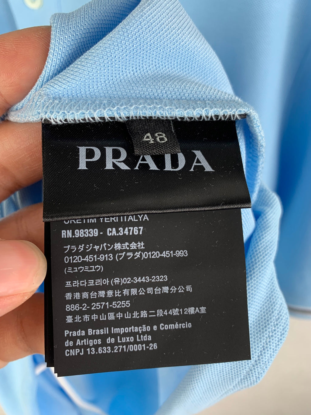 Light blue garment with PRADA size 48 label