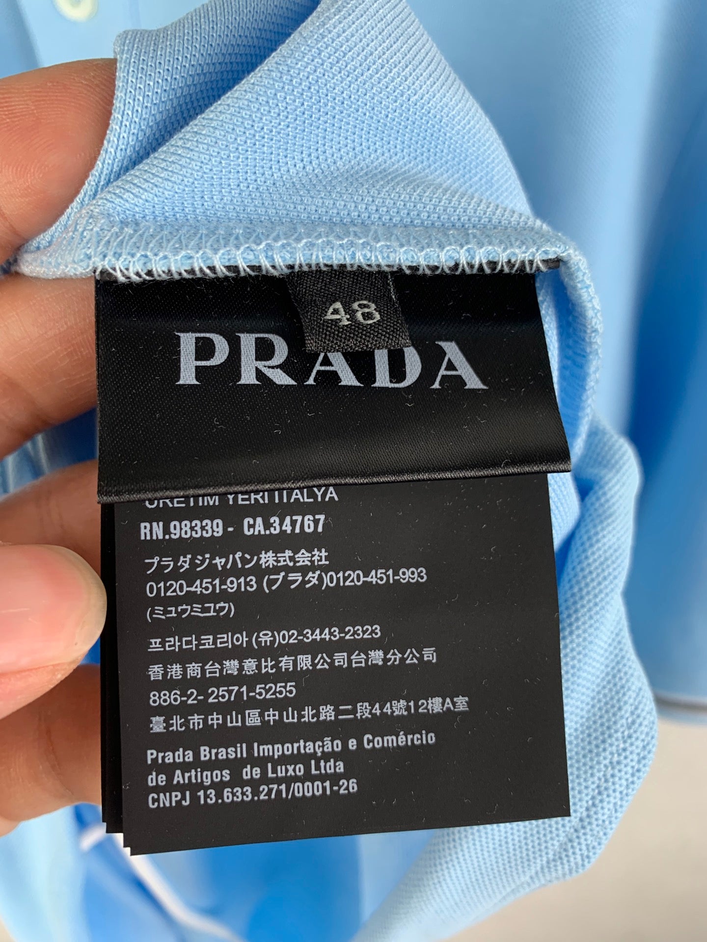 Light blue garment with PRADA size 48 label
