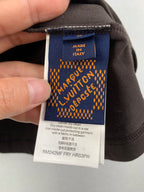 Blue inside care label on dark shorts, marked Made in Italy