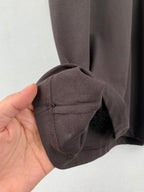 Dark gray shorts cuff with stitched hem and seam detail