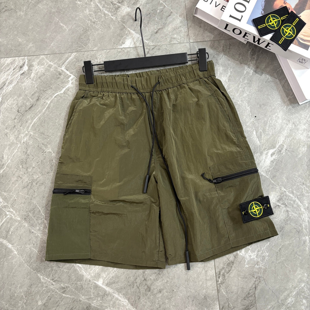 Olive cargo shorts with drawstring waist and side zipper pocket with Stone Island patch