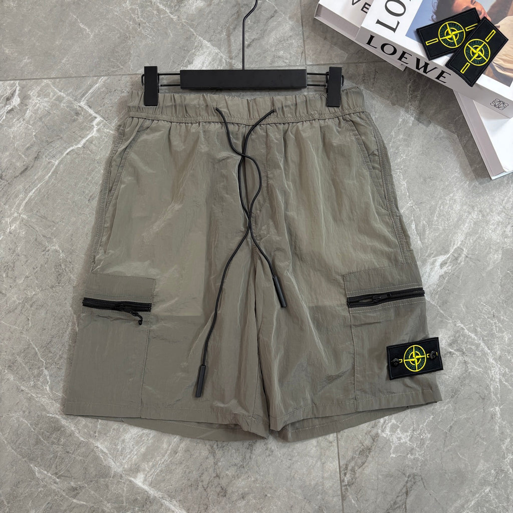 Beige cargo shorts with drawstring waist and side zipper pocket with Stone Island patch