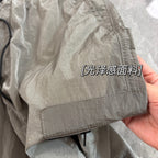 Lightweight jacket sleeve cuff with stitched hem and drawstring