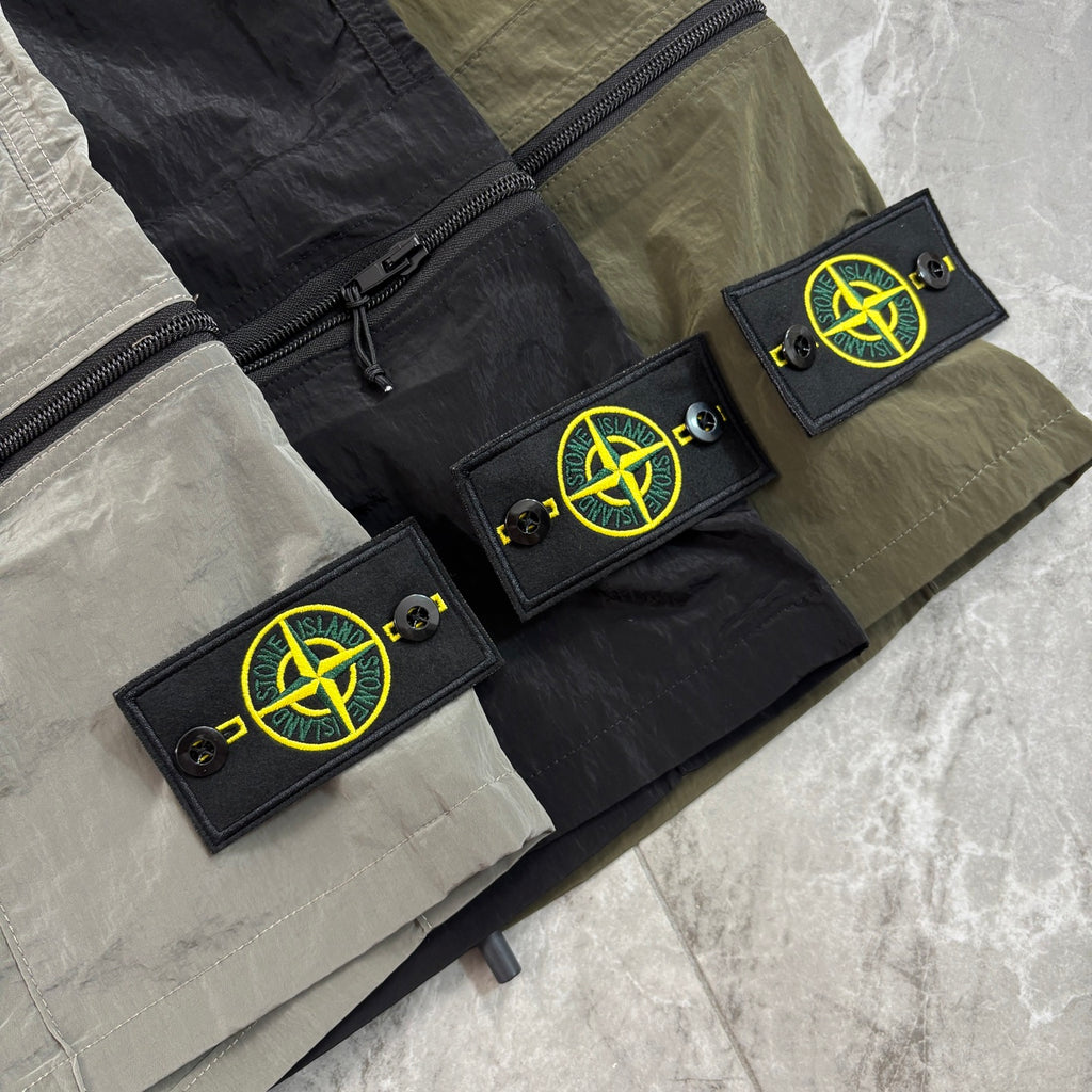 Panelled utility pants with zipper pockets and neon logo patches