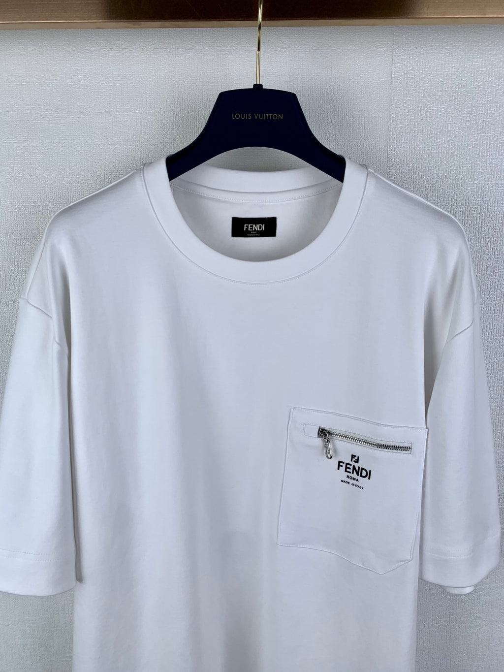 White Fendi T-shirt front, chest pocket with silver zipper and Fendi logo