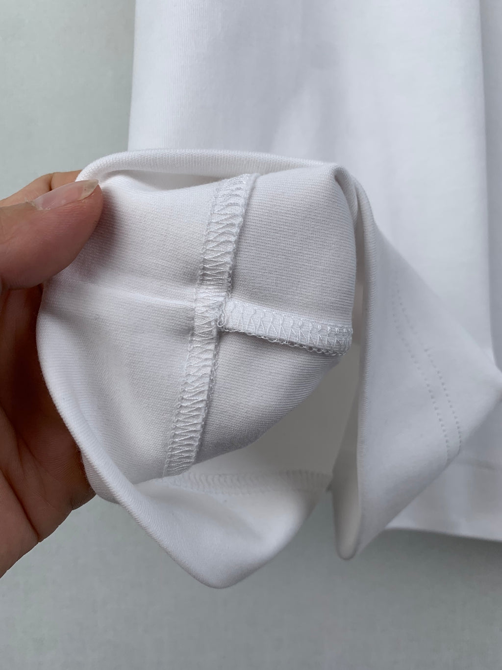 White Fendi T-shirt folded cuff with stitched seam close-up
