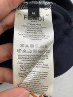 Dark clothing neckline label with FENDI brand text