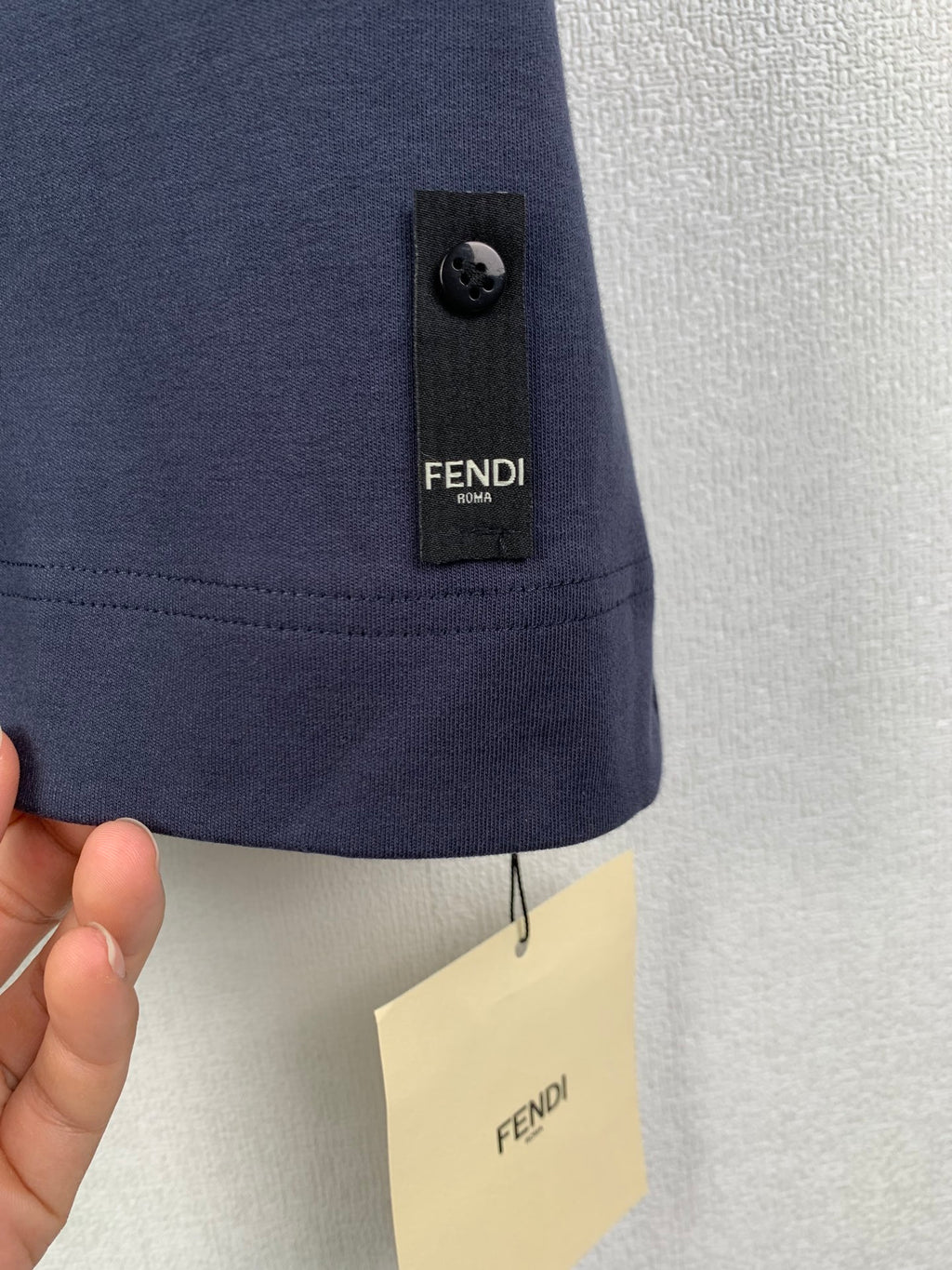 Fendi dark blue T-shirt hem with button and black Fendi tag