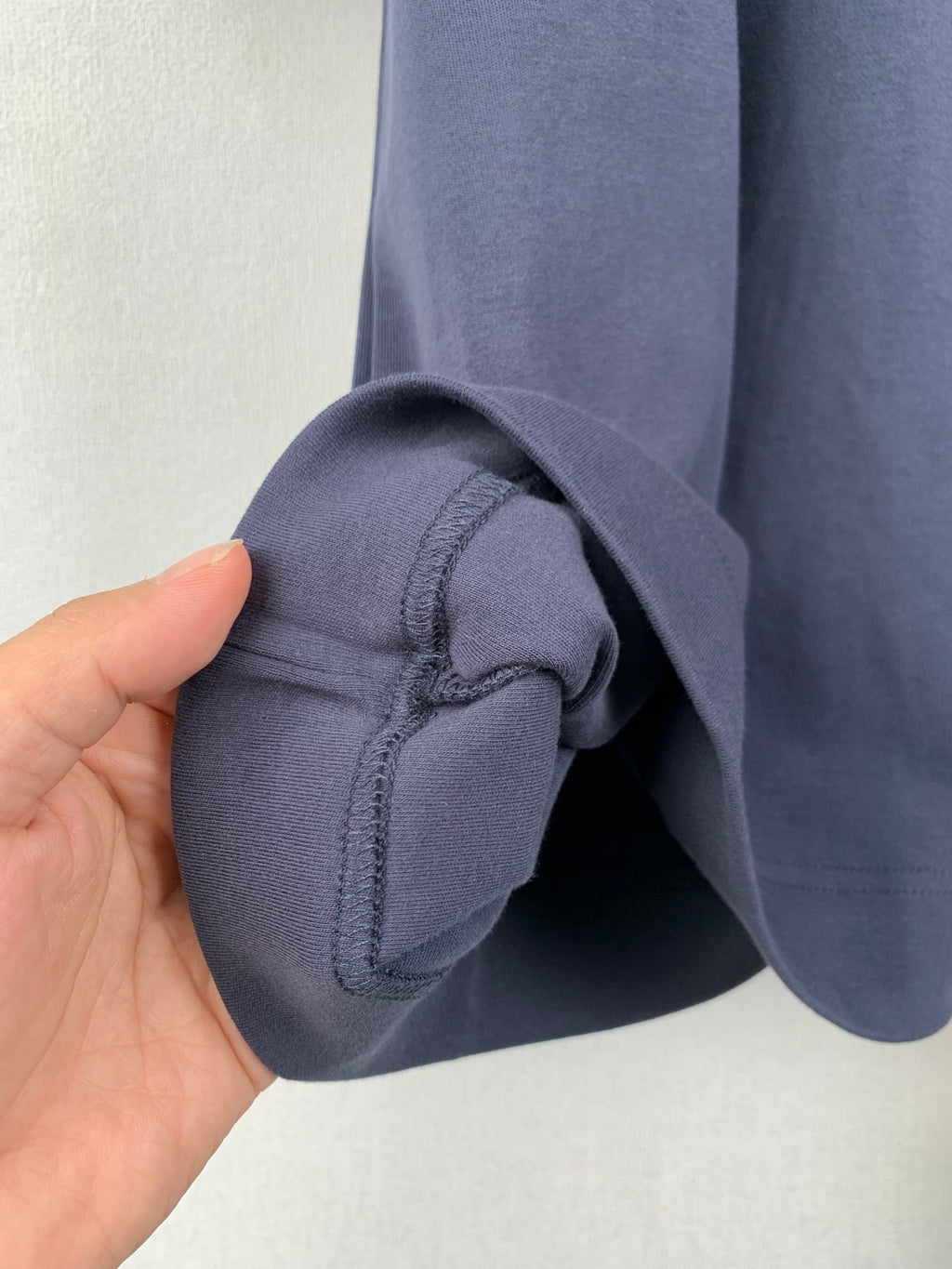Fendi dark blue T-shirt sleeve cuff with inner stitch seam close-up
