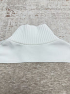 Sweater collar with ribbed white band on heather gray knit body