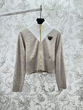 Long-sleeve zip sweater, heather gray with white ribbed turtleneck and gold zipper