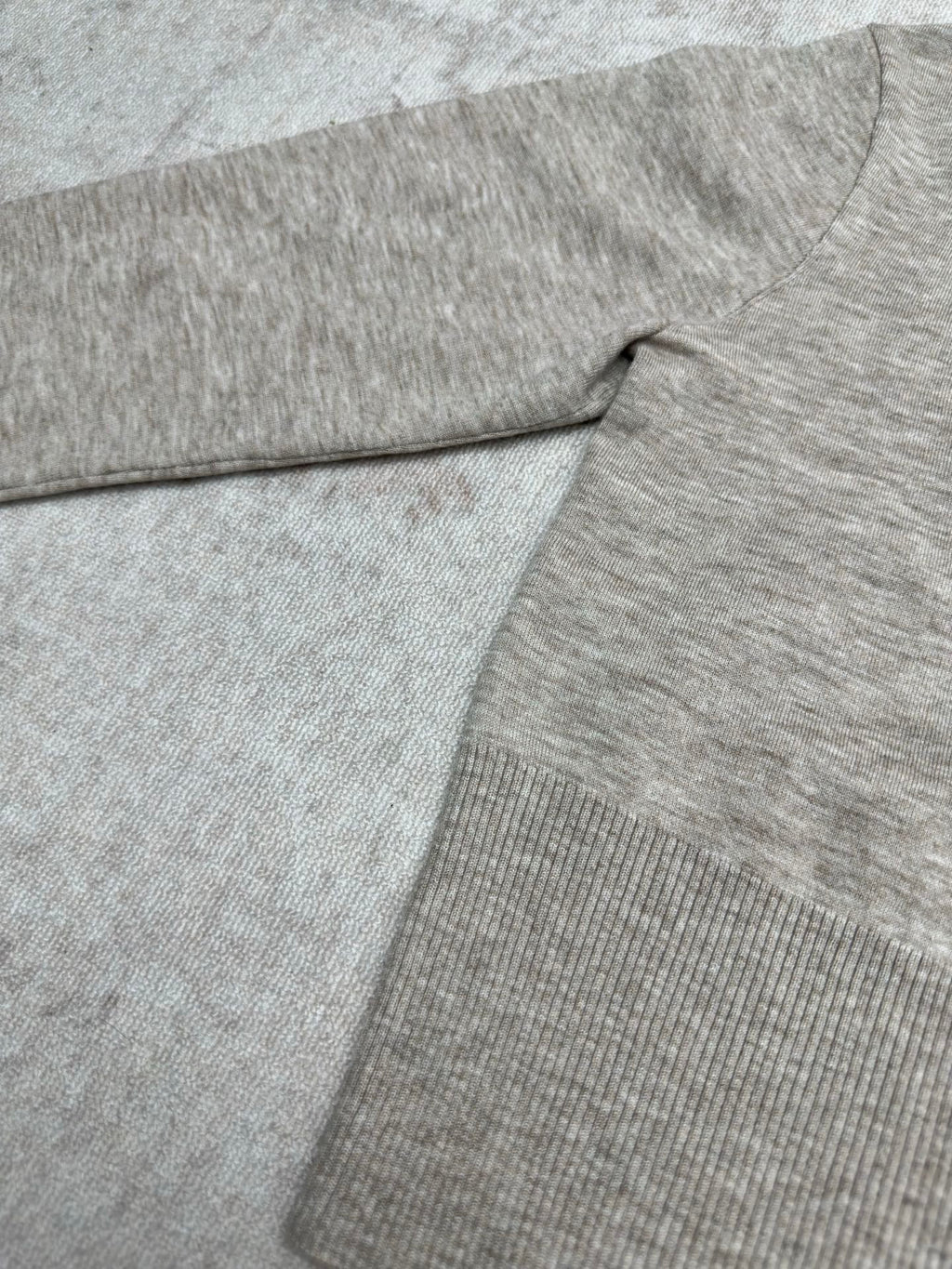 Heather gray long-sleeve sweater with ribbed knit hem and fold detail