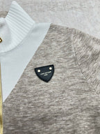 Long-sleeve sweater with ribbed white turtleneck and heather gray chest detail