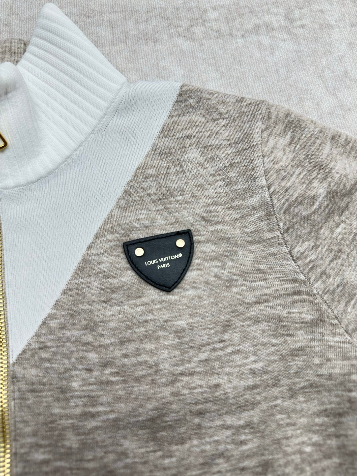 Long-sleeve sweater with ribbed white turtleneck and heather gray chest detail