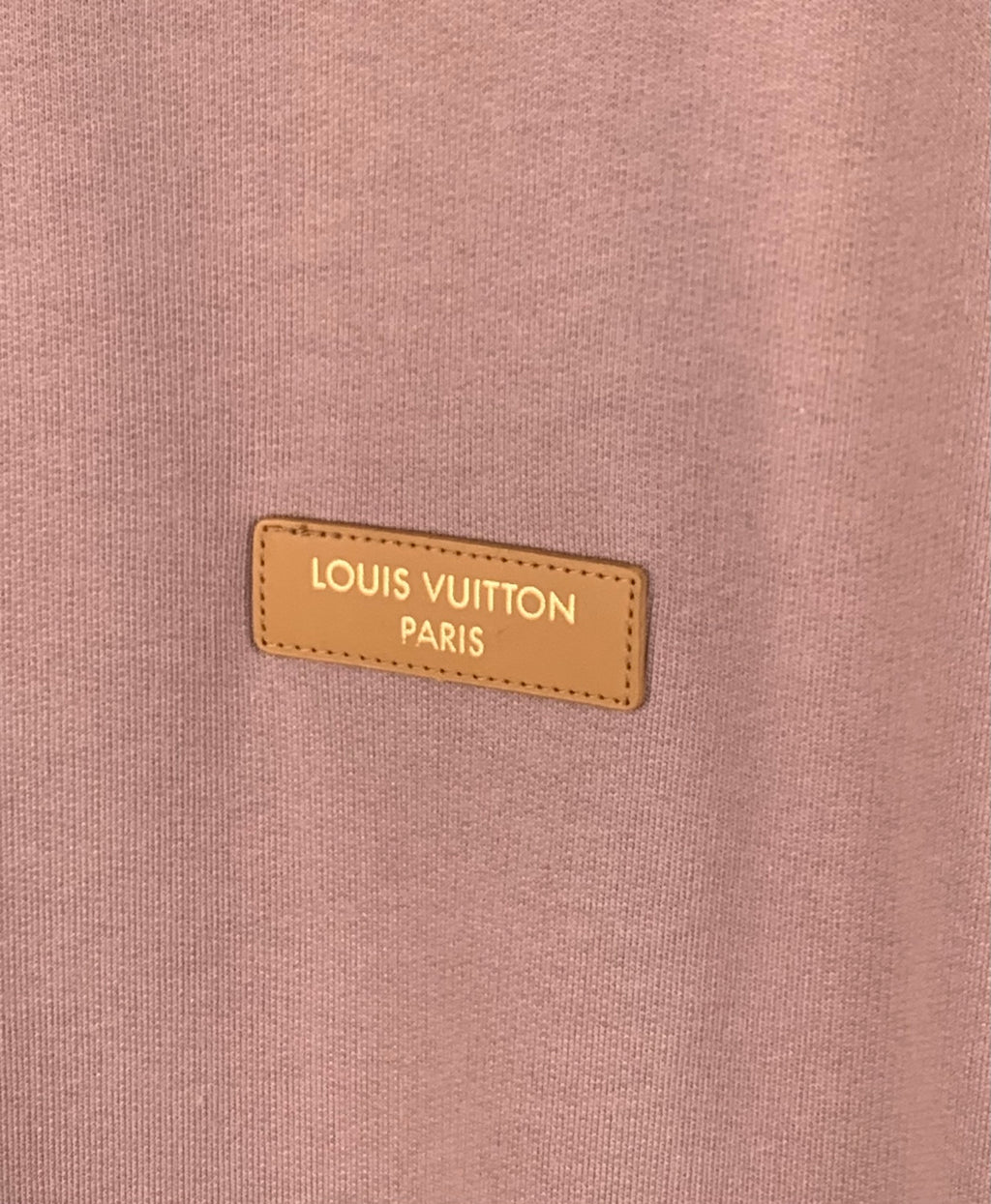 Louis Vuitton Paris logo label on mauve pink sweatshirt chest