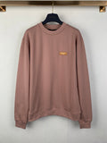 Louis Vuitton crewneck sweatshirt with small gold logo patch, long sleeves, mauve pink