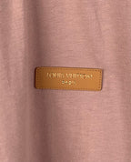 Louis Vuitton Paris logo leather patch on dusty pink T-shirt chest