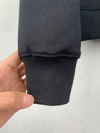 Black sweatshirt sleeve cuff with ribbed hem and stitching