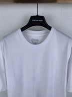 Off white crew-neck T-shirt, neckline and shoulder seam close-up