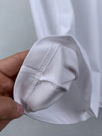 Off white T-shirt sleeve cuff with reinforced seam close-up