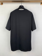 Back view short-sleeve crewneck T-shirt in dark charcoal, plain with no visible print